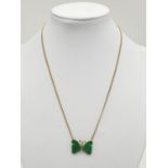Jade butterfly necklace on 9ct gold weighs 5gm, 38cm.