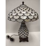 Tiffany style mushroom Lamp 60 cms tall and 42 cm diameter. Scratched on one panel.