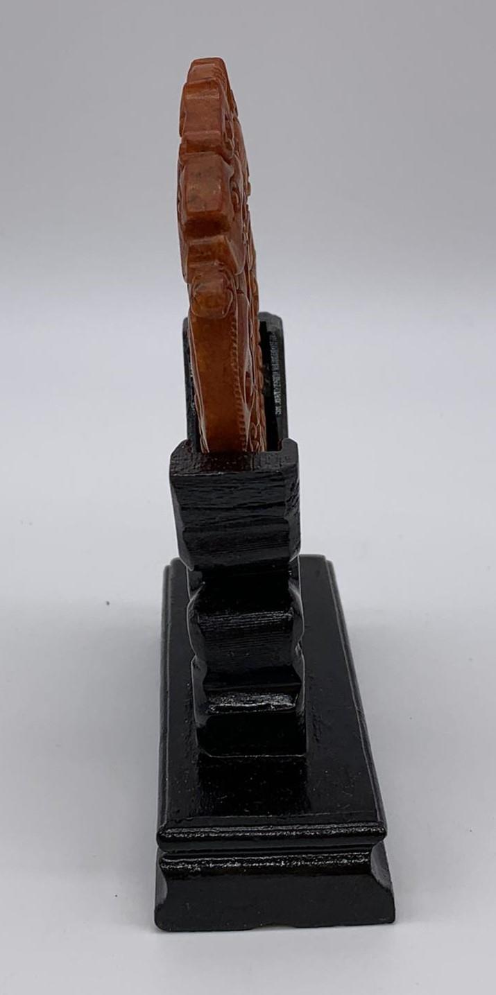 A Chinese, hand carved on both sides and pierced, orange hard stone amulet representing two - Image 2 of 4