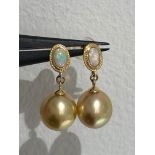 South Sea gold pearl studs in 18k gold with opals; each pearl of top quality and around 9mm