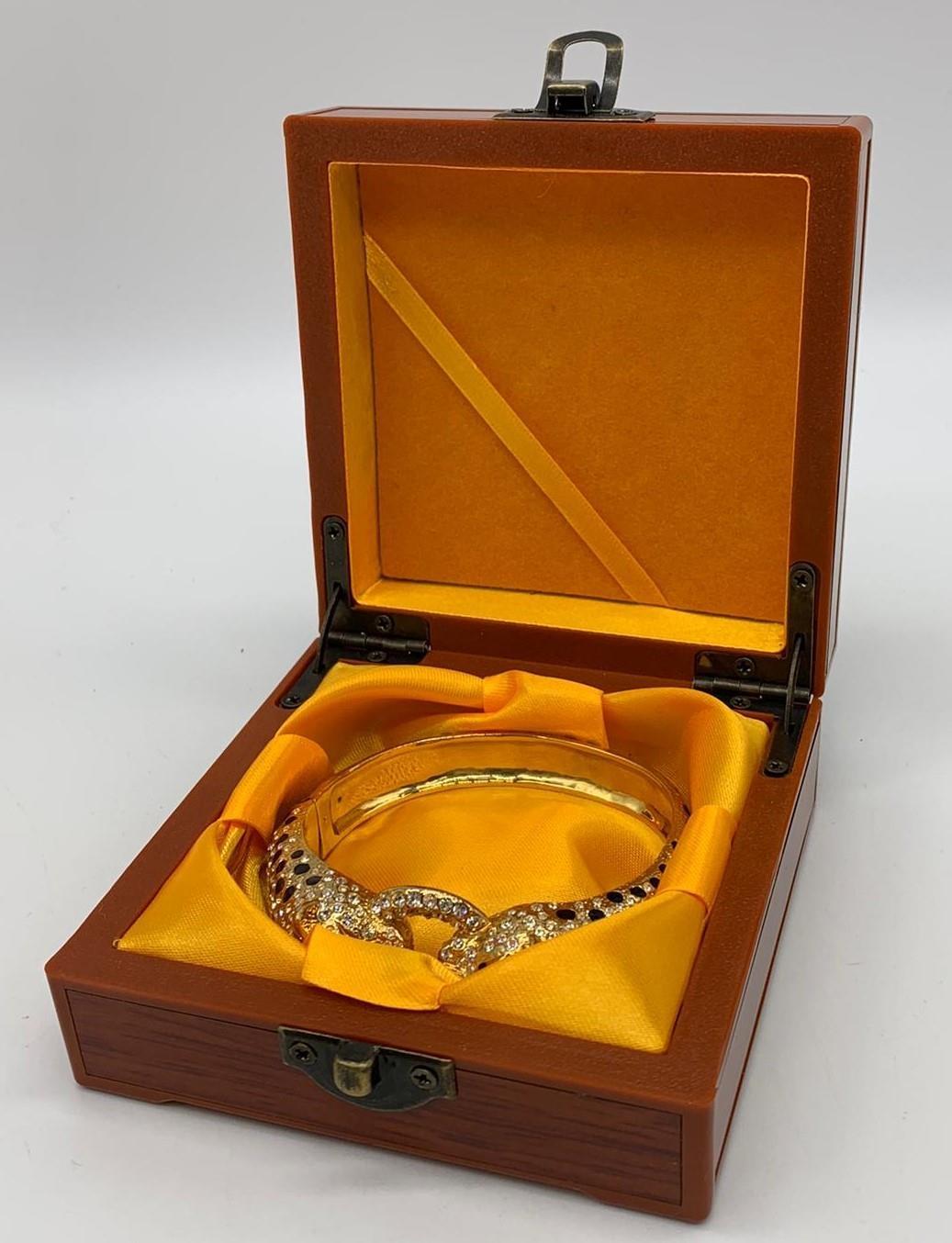 A large silver (stamped 925) and gold plated bracelet in the Cartier style Weight: 82g. In a - Image 2 of 6