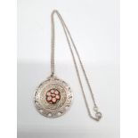 Large silver round pendant with floral enamel designed on a 52cm long silver chain, pendant 4cm