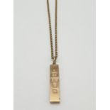 9ct gold ingot (5cm long) from 1977 Jubilee year on a 60cm long 9ct gold belcher chain, weight 43.9g