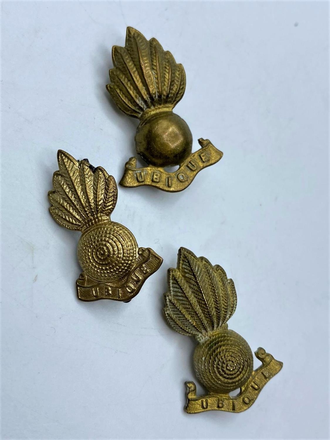 Royal Artillery brass UBIQUE with a pair of collar badges matching