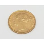 Gold sovereign dated 1884 with young Victoria head in good condition, 8g of 22ct gold