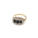 9ct Gold Ring with 3 centre Sapphires surround by small diamond. 3g size N