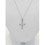 Art deco style sapphire and diamond cross pendant set in 18ct gold, on a 46cm long 9ct gold chain,