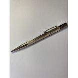 Vintage silver propelling pencil, hexagonal form with engine turned design to three sides, clear