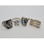 Four assorted silver rings, weight 23.1g.