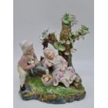 Meissen ceramic statue of boy and girl. 22cm tall by 21cm wide.