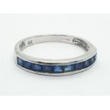 9ct white gold half eternity sapphire ring, weight 1.63g and size N