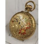 Antique ladies solid gold Pocket watch with enamel back , ticks but sometimes stops