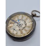 Silver Pocket watch with ornate face and gold Roman Numerals rear wind circa 1880's, overwound