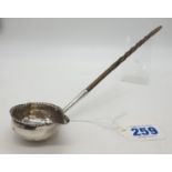 George III silver Ladle with Coin set in the bottom of the bowl, dated 1787, some damage 28g 32cms