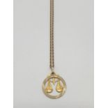 9ct gold pendant on a 56cm long gold chain, weight 5.2g