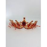 red tiara with rhinestones