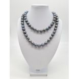 A long South sea baroque pearl necklace, individually knotted pearls sizing from 9-11mm,137g