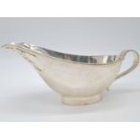 A Sterling Silver Gravy Boat in Modern Design. Weight:230g. Width: 22cm. Height:8cm