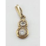18ct yellow gold diamond set pendant in the shape of number 8, approx 1cm long