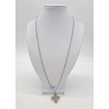 Vintage silver cross set on a 62cm long silver linked chain, weight 9.79g and pendant 3cm long
