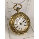 Rare unusual yellow metal pocket watch with Egyptian hieroglyphs on the case , winds and ticks but