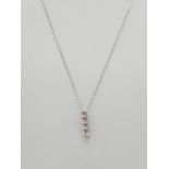 18k gold and diamond set pendant on a 9ct gold 45cm long chain, weight 1.4g and pendant 15mm long