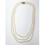 3 rows of Cultured pearl necklace set in 9ct gold clasp , weight 49g and 46cm long approx