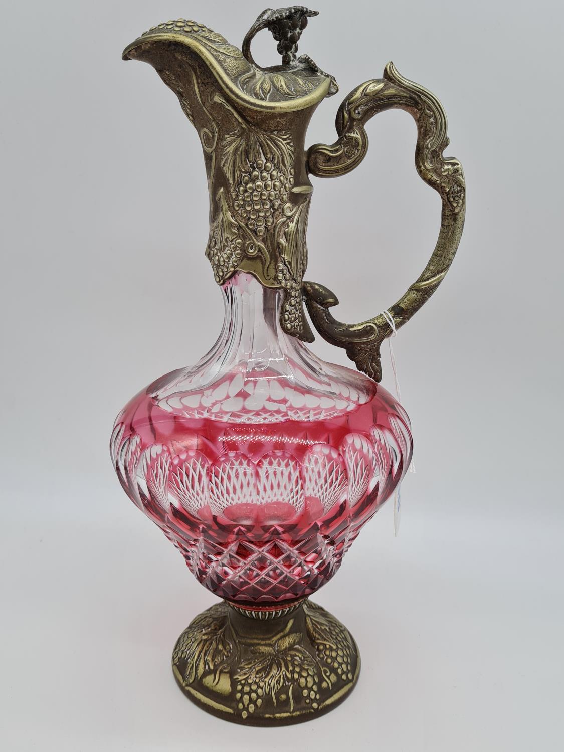 Mappin & Webb Cranberry glass wine jug with ornate fruit decoration, 1.3kg total weight and 32cm