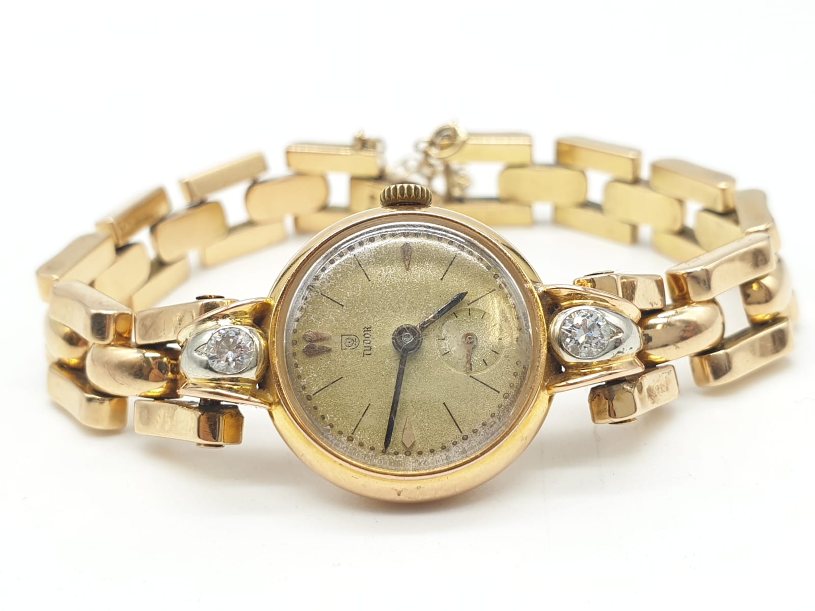 18ct gold Tudor vintage ladies watch, diamonds on each side of face, comes with safety chain and