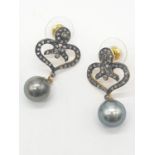 Pair of South sea pearl earrings set in rose diamonds , 3cm drop and pearl size 8mm approx