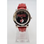 Coca Cola Watch with rotating logo second counter, red leather strap