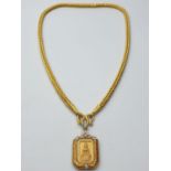 21ct Buddhist pendant on 21ct necklace, weight 101.7g and 56cm long approx