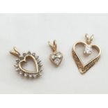 3x assorted stone set heart pendants (1 x 9ct, 1x 14ct and 1 x no HM), total weight 3.15g (3)