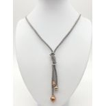 Silver gilt knot style necklace, chain 49cm long and the drop is 9cm long, weight 22.71g approx