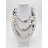 A very long Cartier style pearl necklace set in 14ct gold mother of pearl clasp, various shades of