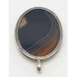 Vintage large oval silver and agate pendant having a silver rope border with streaky brown agate