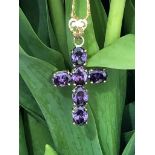 9k yellow gold cross with calibrated amethysts of exceptional quality ( 6 stones, oval cuts, each