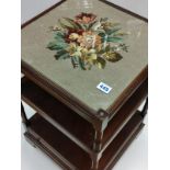 An occasional Table with 2 shelves and bottom draw with an embroidery under glass top 46 x 46 cm &