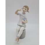 Lladro girl with doll eating. 19cm tall.