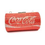 A funky, evening bag designed in the style of a COCA COLA tin, totally covered with Swarovski