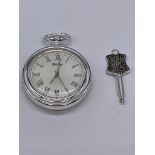 Reproduction pocket watch and key. Skeleton back and key winding to side. Full working order.