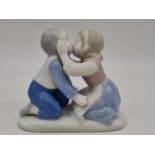 German porcelain boy and girl kissing, 11cm tall.
