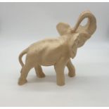 White resin African elephant with trunk in the air (11.5 length) (9.5 height) (2.20 Kg)