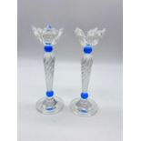A Pair of Swarovski Silver Crystal Candle Holders. Both come in separate presentation box.