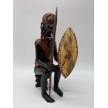 Hand carved figure of a Maasai warrior. 26cm tall.