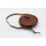 A John Rabone and Sons vintage leather cased surveyors tape measure.