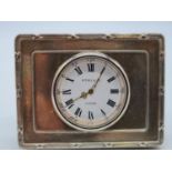 Kitney and Co. miniature clock with silver surround. 7cm by 5cm.