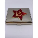 Vintage Russian cigarette case in white metal. Large red enamel star on lid, complete with hammer
