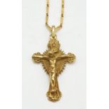18ct yellow gold crucifix pendant on a 42cm long 18ct gold link chain, weight 19.4g and pendant is
