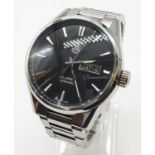 Carrera Tag Heuer Calibre 5 automatic gents watch with black face and white metal strap and skeleton